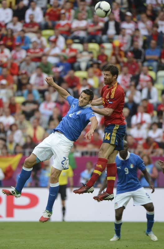 Italian defender Christian Maggio (L) fights for the ball with Spanish midfielder Xabi Alonso during the Euro 2012 championships football match Spain vs Italy on June 10, 2012 at the Gdansk Arena. AFP PHOTO / PIERRE-PHILIPPE MARCOUPIERRE-PHILIPPE MARCOU/AFP/GettyImages