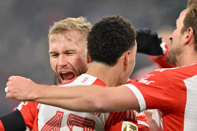 Bayern Munich's Jamal Musiala (C) celebrates after scoring his side's first goal of the game during the German Bundesliga soccer match between Bayern Munich and TSG 1899 Hoffenheim at the Allianz Arena. Peter Kneffel/dpa