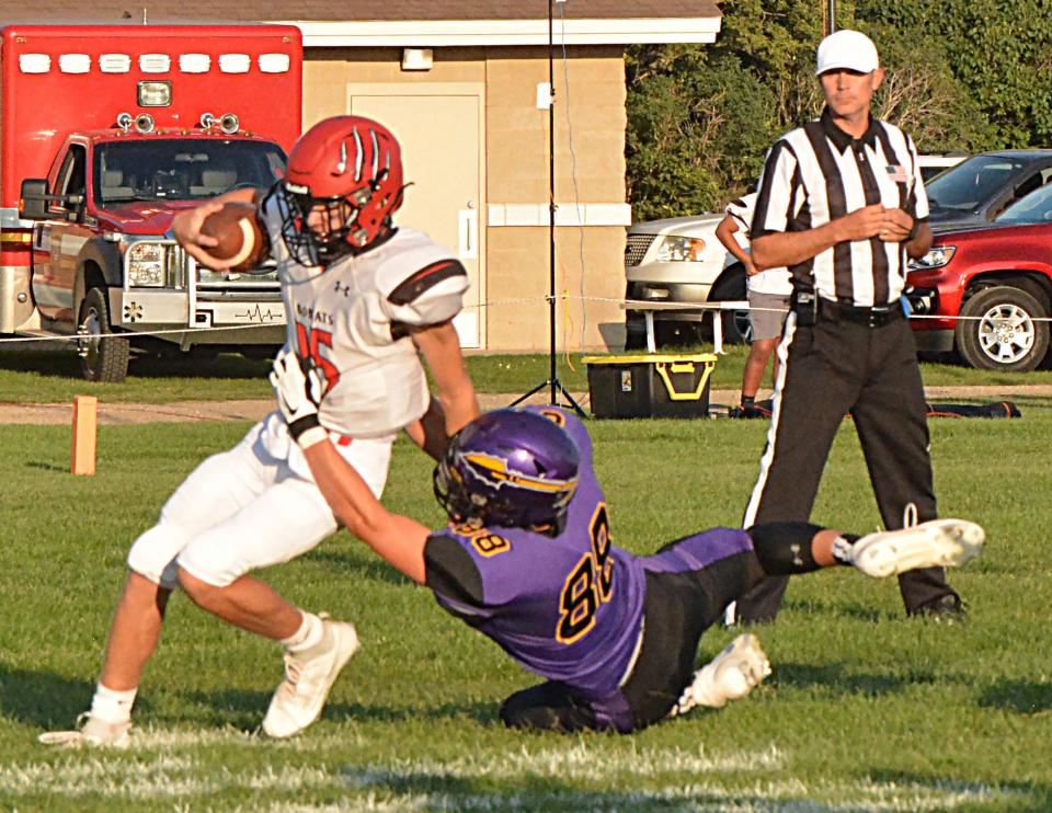 Watertown's Caden Beauchamp brings down Brookings' quarterback Jones Huntimer during their season-opening Eastern South Dakota Conference football game on Friday, Aug. 25, 2023 at Watertown Stadium.