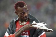 Caleb Ndiku of Kenya reacts after placing second in the men's 5000m event during the 15th IAAF World Championships at the National Stadium in Beijing, China August 29, 2015. REUTERS/Lucy Nicholson