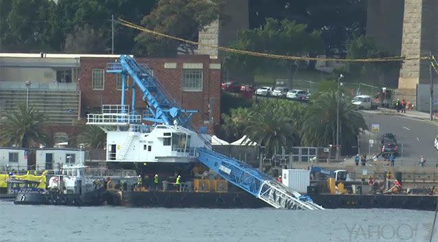 Crews are currently working on the crane. Source: 7 News