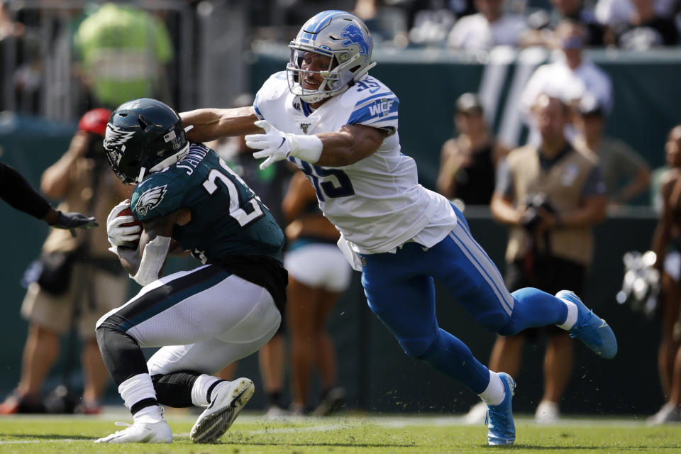 Detroit Lions' Miles Killebrew, right, tackles Philadelphia Eagles' Miles Sanders during the first half of an NFL football game, Sunday, Sept. 22, 2019, in Philadelphia. (AP Photo/Matt Rourke)