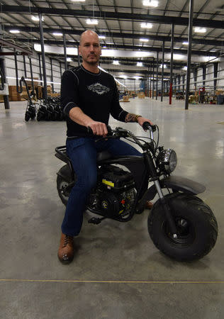 Alex Keechle, CEO of Mini motorcycle and go-kart maker Monster Moto, poses on the factory floor in Ruston, Louisiana January 25, 2017. Picture taken January 25, 2017. REUTERS/Nick Carey