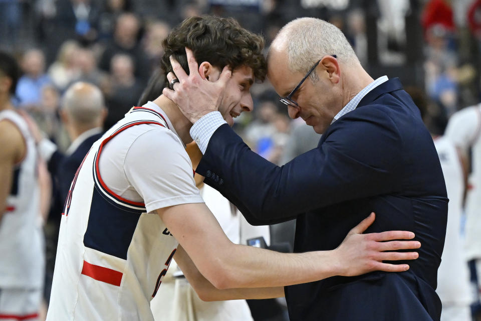 UConn head coach Dan Hurley, right, reacts with guard and son Andrew Hurley after the 88-65 win against Arkansas of a Sweet 16 college basketball game in the West Regional of the NCAA Tournament, Thursday, March 23, 2023, in Las Vegas. (AP Photo/David Becker)