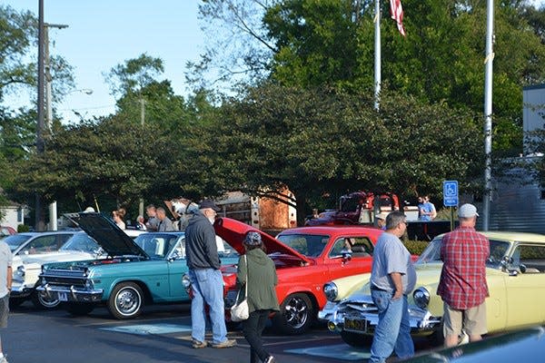 Attendees view the cars on display at a past "Cars and Coffee" event at the Studebaker National Museum. The 2023 season begins May 13 and continues on the second Saturday of the month through October.