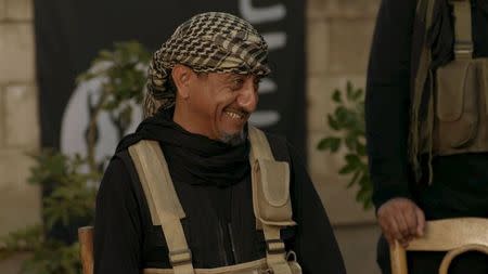 Saudi actor Nasser al-Qasabi smiles as he plays the role of an Islamic State fighter in the new Saudi TV show "Selfie," a sketch comedy show which debuted last week on Saudi-owned pan-Arab satellite channel MBC, in this undated handout photo provided by MBC. REUTERS/MBC/Handout via Reuters