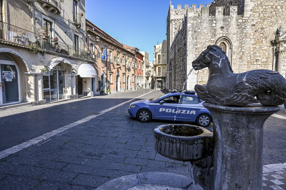 TAORMINA , ITALY - APRIL 08: A police car patrols an empty downtown street after government restrictions to avoid spread of Covid-19 on April 08, 2020 in Taormina, Italy. There have been well over 100,000 reported COVID-19 cases in Italy and more than 15,000 related deaths, but the officials are confident the peak of new cases has passed. (Photo by Fabrizio Villa/Getty Images)