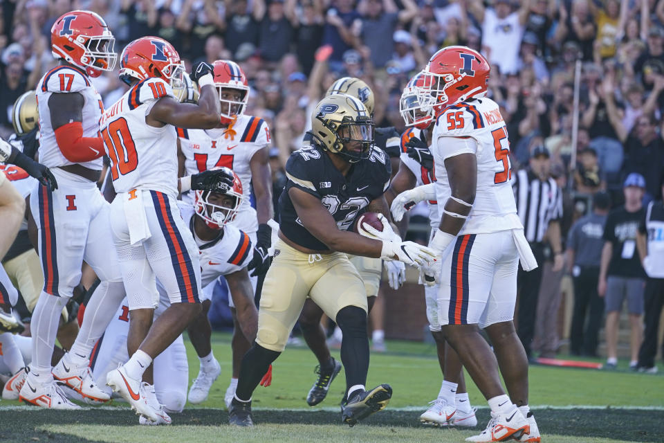 Purdue running back Dylan Downing (22) celebrates touchdown against Illinois during the first half of an NCAA college football game in West Lafayette, Ind., Saturday, Sept. 30, 2023. (AP Photo/Michael Conroy)