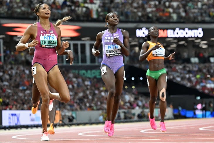 <span class="article__caption">USA’s Gabrielle Thomas (L), Britain’s Dina Asher-Smith and Ivory Coast’s Maboundou Kone (R) react after the women’s 200m semi-final during the World Athletics Championships at the National Athletics Centre in Budapest on August 24, 2023. (Photo by Jewel SAMAD / AFP) </span> (Photo: JEWEL SAMAD/AFP/Getty Images)