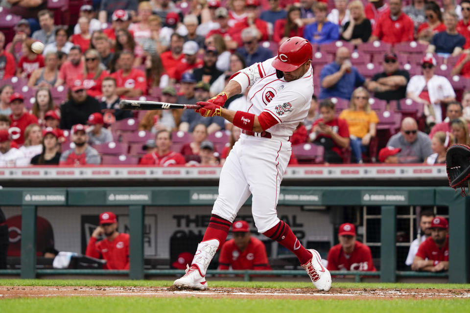 Cincinnati Reds' Joey Votto hits a three-run home run during the first inning of the team's baseball game against the Washington Nationals on Thursday, June 2, 2022, in Cincinnati. (AP Photo/Jeff Dean)