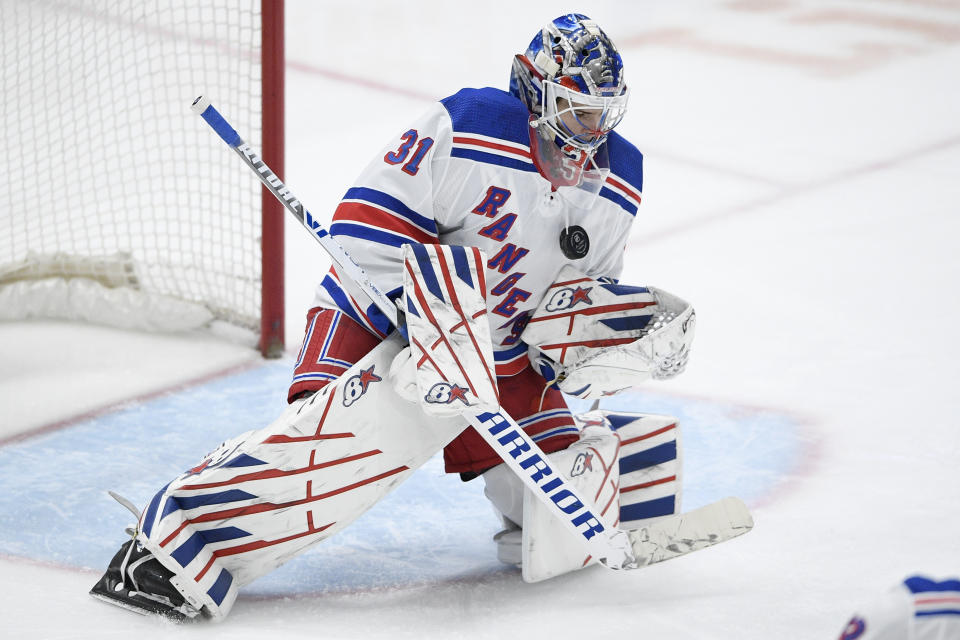 New York Rangers goaltender Igor Shesterkin (31) stops the puck during the first period of an NHL hockey game against the Washington Capitals, Saturday, Feb. 20, 2021, in Washington. (AP Photo/Nick Wass)
