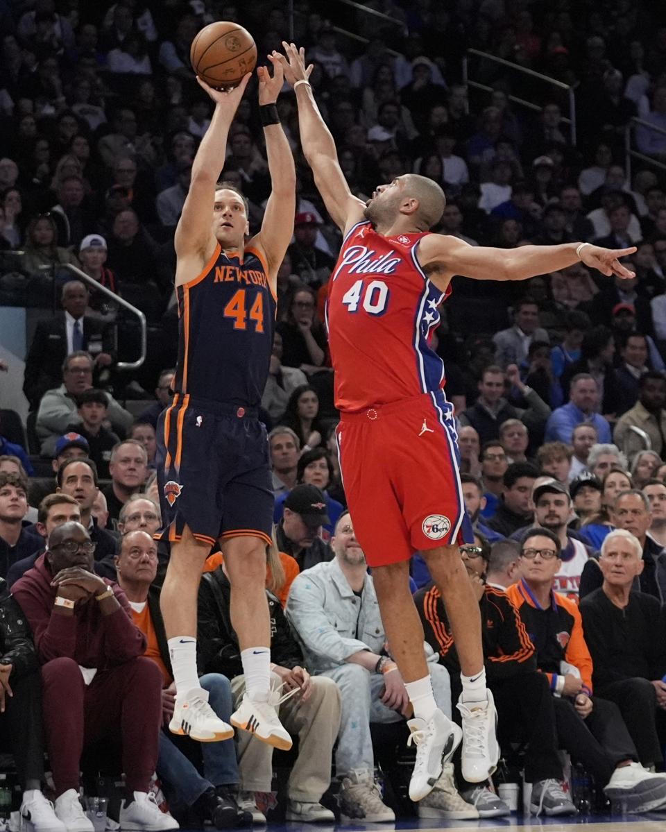 Philadelphia 76ers' Nicolas Batum (40) defends against a shot by New York Knicks' Bojan Bogdanovic (44) during the second half of Game 2 in an NBA basketball first-round playoff series Monday, April 22, 2024, in New York. (AP Photo/Frank Franklin II)