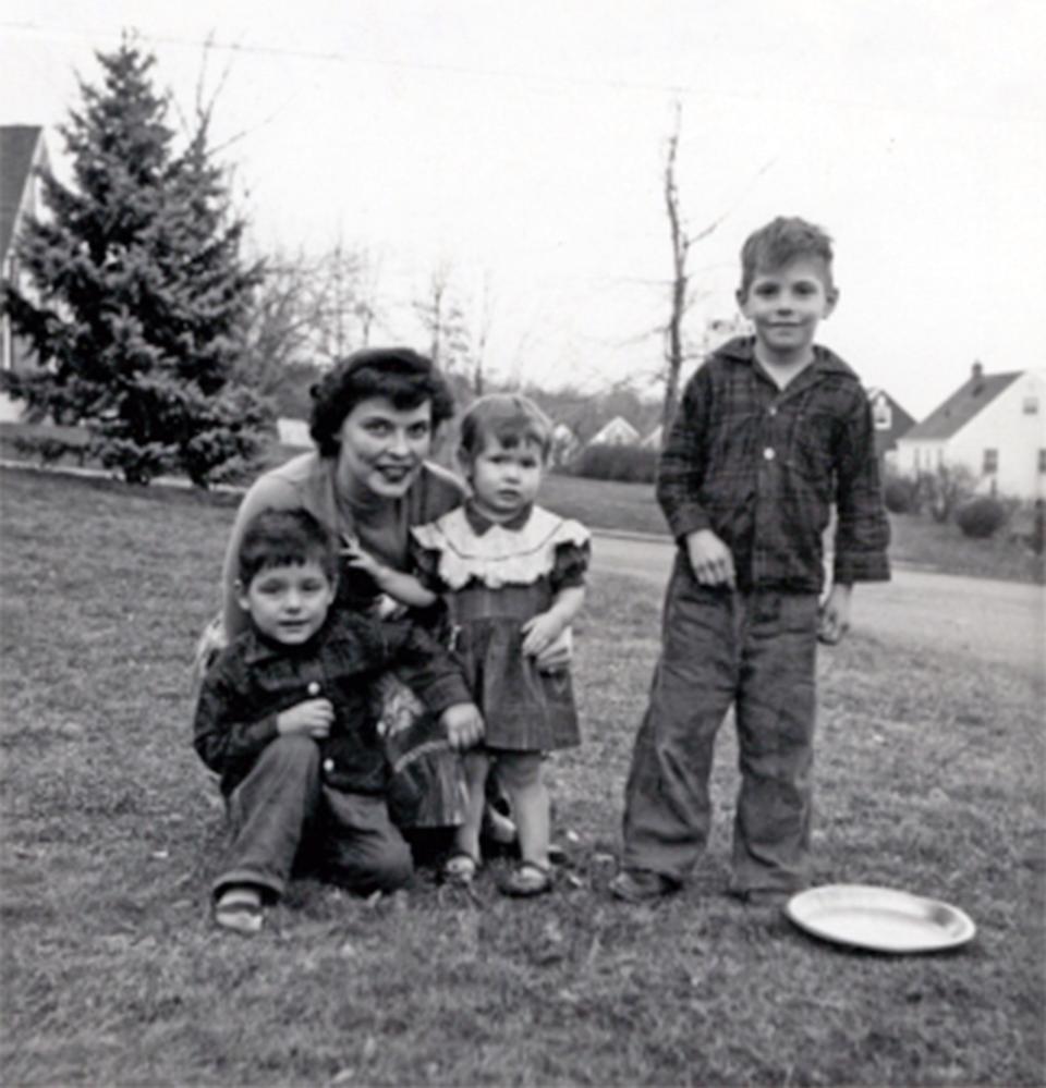 Siblings Roy Charles Deaver, Linda Caroline Deaver and their half brother Daniel Richard Robertson, front from left, take a photo with their mother Edra Louise Deaver in December 1956 in St. Louis, who is pregnant with her fourth child, Debra Marie Deaver. Edra Deaver was a burlesque performer and all of her children eventually were either adopted and their names changed or put into foster care.