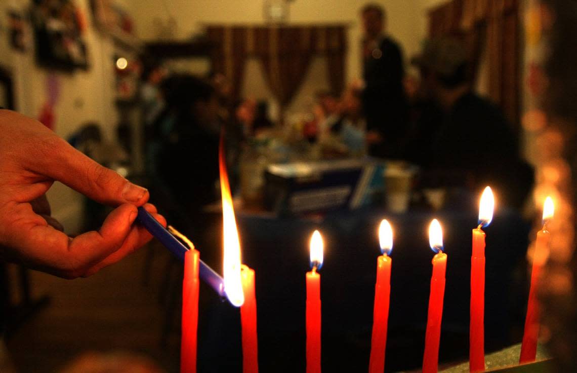 Families with gather for the lighting of the menorah during a Hanukkah celebrations.