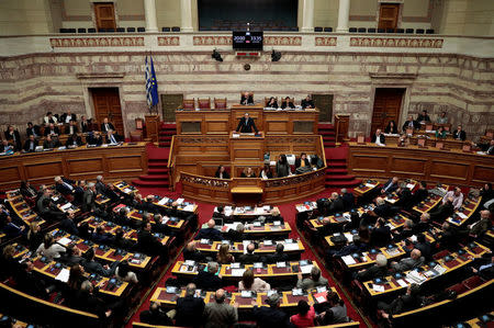 Former Greek Prime Minister Antonis Samaras addresses lawmakers during a parliamentary session before a vote on setting up a special committee which will probe the role of ten politicians in a case which involves alleged bribery by Swiss drugmaker Novartis, in Athens, Greece, February 21, 2018. REUTERS/Alkis Konstantinidis