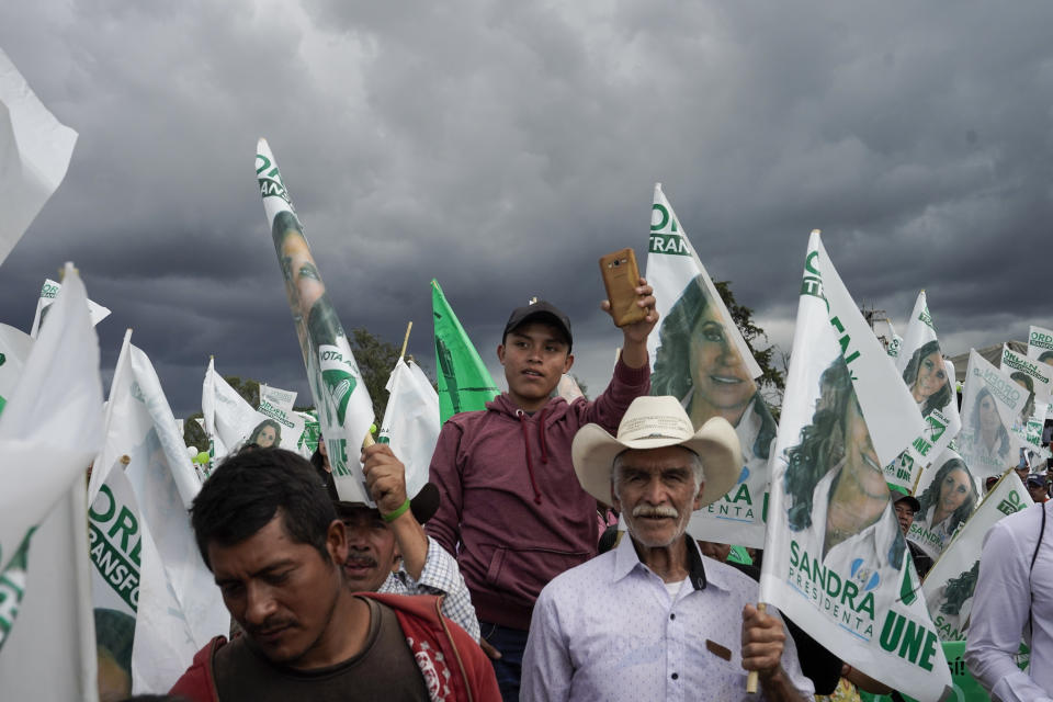 Supporters wait for the arrival of former first lady Sandra Torres, the National Unity of Hope, UNE, presidential candidate, during a campaign rally in Chimaltenango, Guatemala, Aug. 13, 2023. Torres will face Bernardo Arévalo of the Seed Movement party in the Sunday, Aug. 20 runoff election. (AP Photo/Moises Castillo, File)