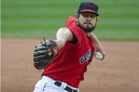 FILE - In this Sept. 27, 2020, file photo, Cleveland Indians relief pitcher Brad Hand delivers to Pittsburgh Pirates' Josh Bell during the ninth inning of a baseball game in Cleveland. The Cleveland Indians have declined contract options on Brad Hand and first baseman Carlos Santana for next season, decisions that will initially cut $27 million from the team's payroll. (AP Photo/Phil Long, File)