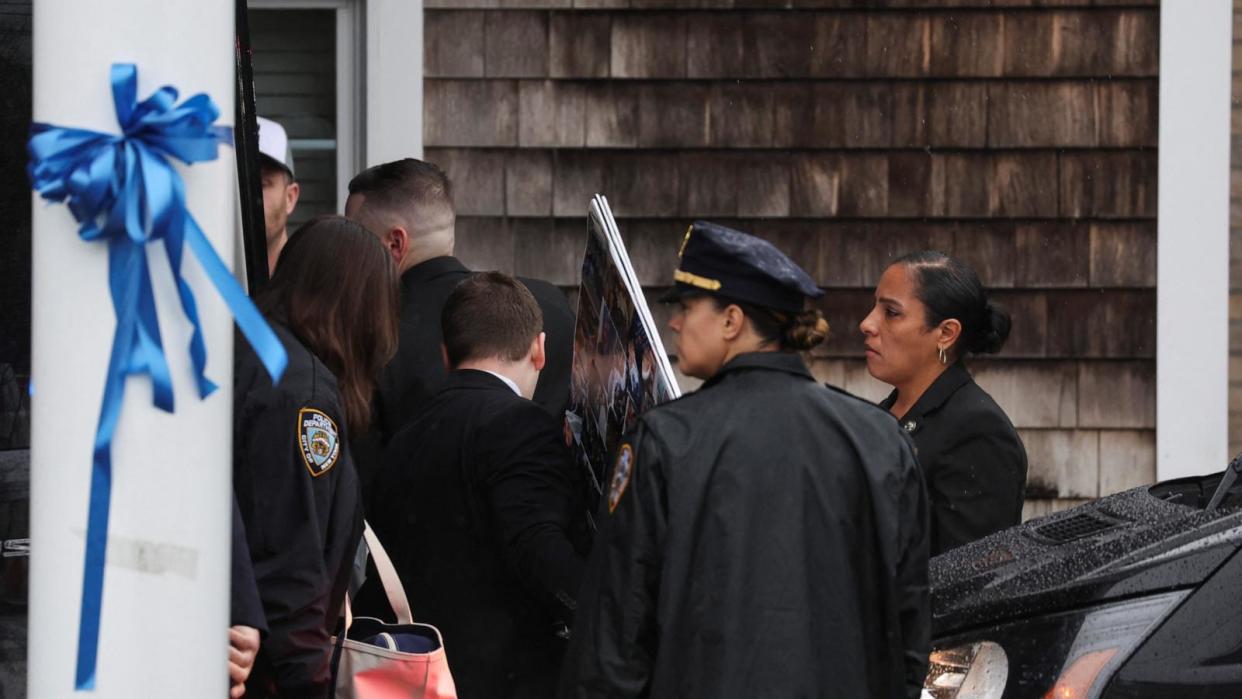 PHOTO: Friends and family arrive at a wake for New York City Police Department (NYPD) officer Jonathan Diller, who was shot and killed while making a routine traffic stop, at a funeral home in Massapequa Park, N.Y., March 28, 2024.  (Shannon Stapleton/Reuters)