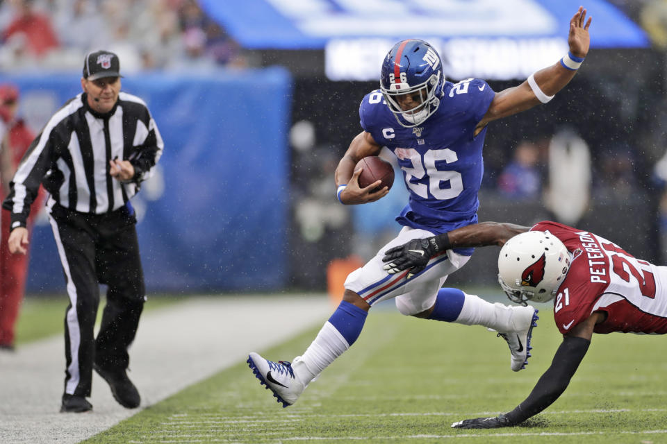 Arizona Cardinals' Patrick Peterson, right, defends against New York Giants' Saquon Barkley during the first half of an NFL football game, Sunday, Oct. 20, 2019, in East Rutherford, N.J. (AP Photo/Adam Hunger)