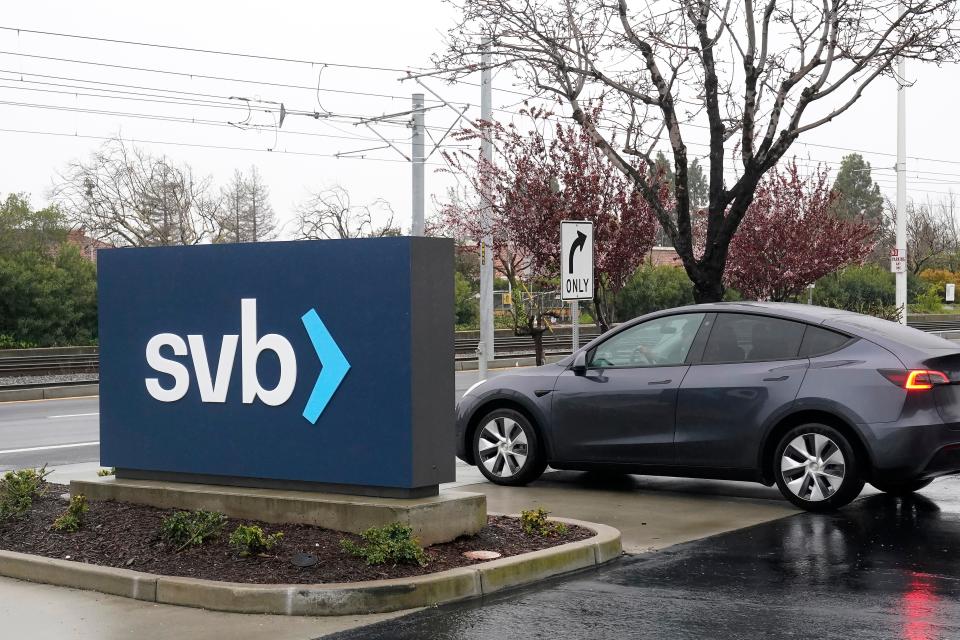 A car drives past a Silicon Valley Bank sign at the company's headquarters in Santa Clara, Calif., Friday, March 10, 2023.