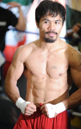 Manny Pacquiao poses at a media day workout at Wildcard Boxing Club in Hollywood, California, on October 26. Pacquiao will defend his World Boxing Organization (WBO) welterweight title against Juan Manuel Marquez in Las Vegas, on November 12