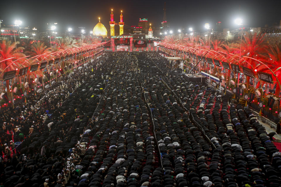 Iraqi Shiites take part in Ashura that marks the martyrdom of Husayn ibn Ali, a grandson of the Islamic prophet Muhammad, and members of his immediate family in the Battle of Karbala, in Karbala, Iraq, Monday, Aug. 8, 2022. (AP Photo/Anmar Khalil)