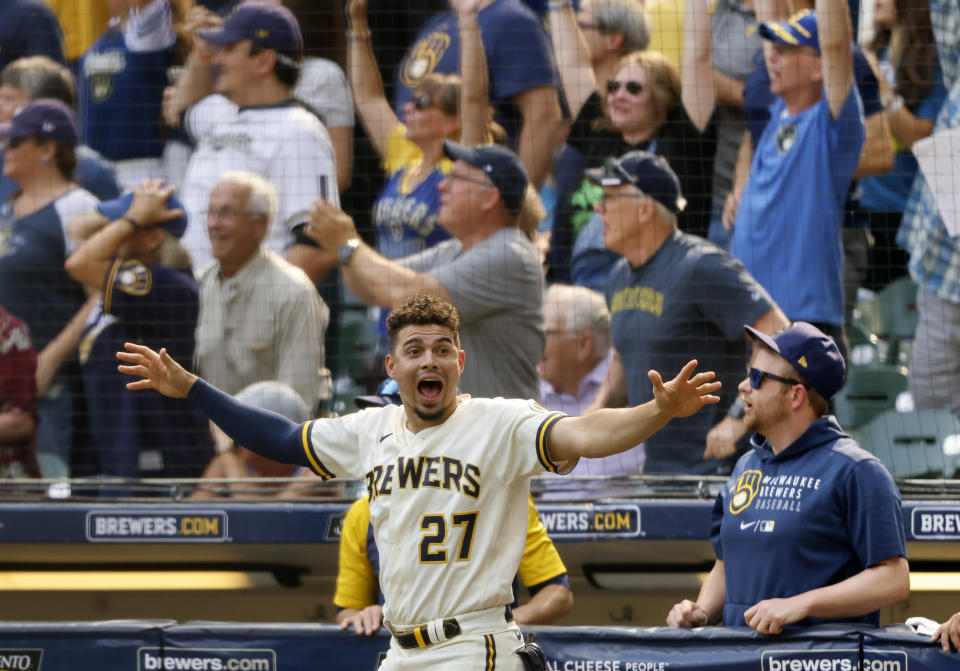 Milwaukee Brewers' Willy Adames reacts to Rowdy Tellez' three-RBI pinch hit home run against the Pittsburgh Pirates during the seventh inning of a baseball game Wednesday, Aug. 4, 2021, in Milwaukee. (AP Photo/Jeffrey Phelps)