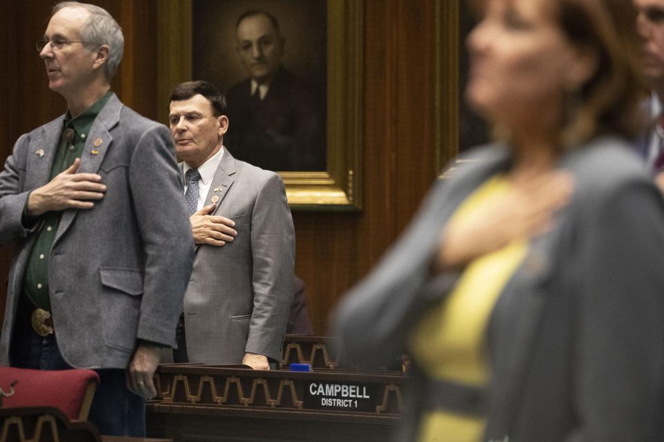 Rep. David Stringer stands on the house floor with other members on Jan. 28, 2019. The Arizona House of Representatives refused to vote on a motion to expel Stringer over revelations that he was charged with sex offenses in 1983.