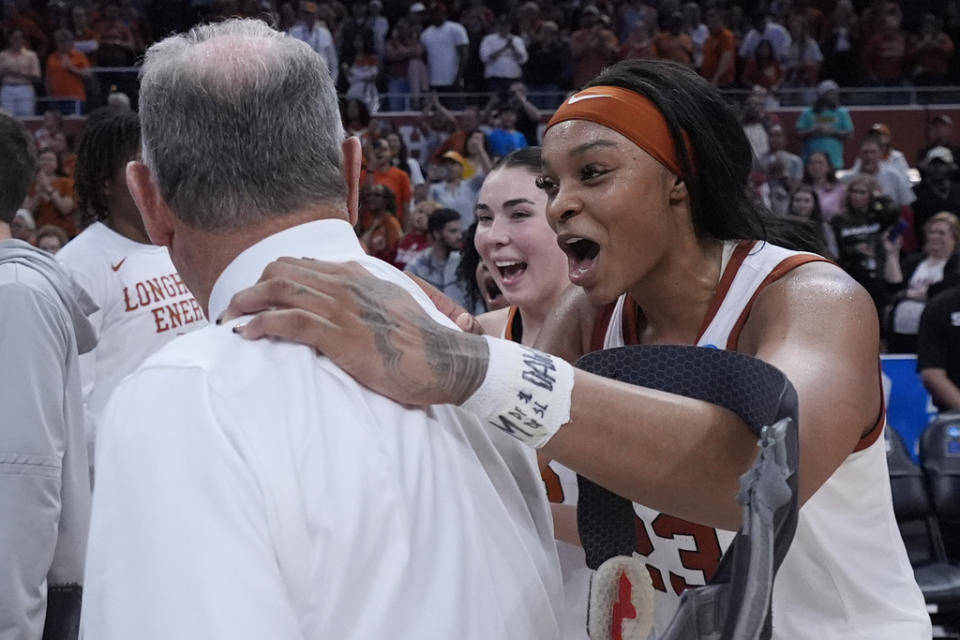 Texas forward Aaliyah Moore, right, celebrates with head coach Vic Schaefer, left, after their win over Alabama in a second-round college basketball game in the women’s NCAA Tournament in Austin, Texas, Sunday, March 24, 2024. (AP Photo/Eric Gay)