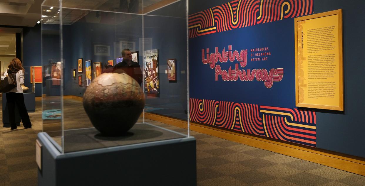 People look at the art in the National Cowboy & Western Heritage Museum's exhibition "Lighting Pathways: Matriarchs of Oklahoma Native Art."