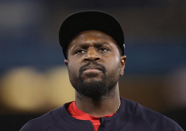 Brandon Phillips doesn't think the Reds should have given his No. 4 to Scooter Gennett. (Getty Images)