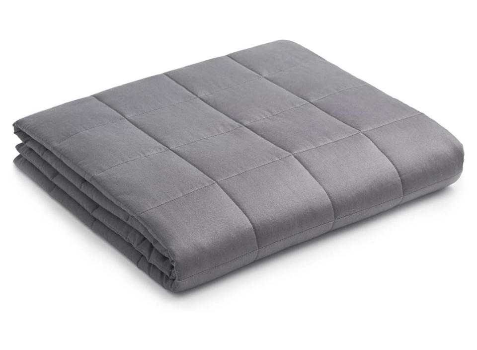 A weighted blanket keeps you warm while also providing comforting pressure. (Source: Amazon)