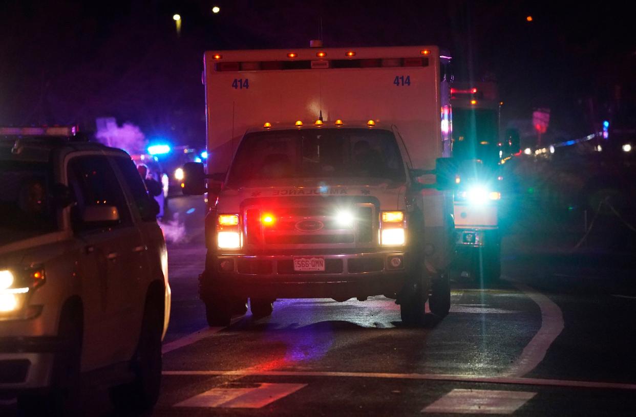 A procession of emergency vehicles leaves a King Soopers grocery store where authorities say multiple people were killed in a shooting, Monday, March 22, 2021, in Boulder, Colo.