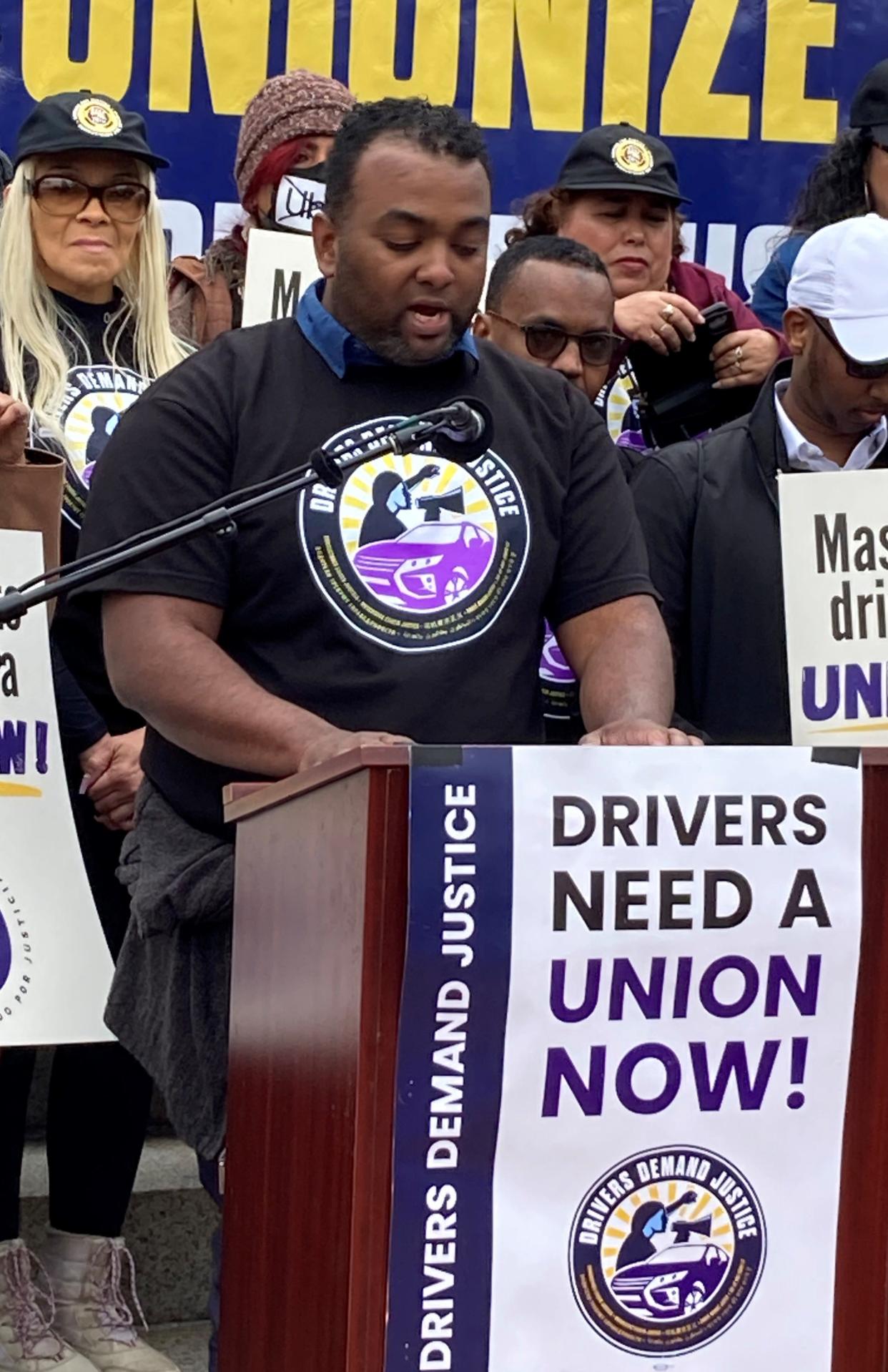 Prisell Polanco of Newton lost a year of work as a rideshare driver after being deactivated by the company based on its mistake at a Drivers Demand Justice rally on the Massachusetts State House steps Wednesday.