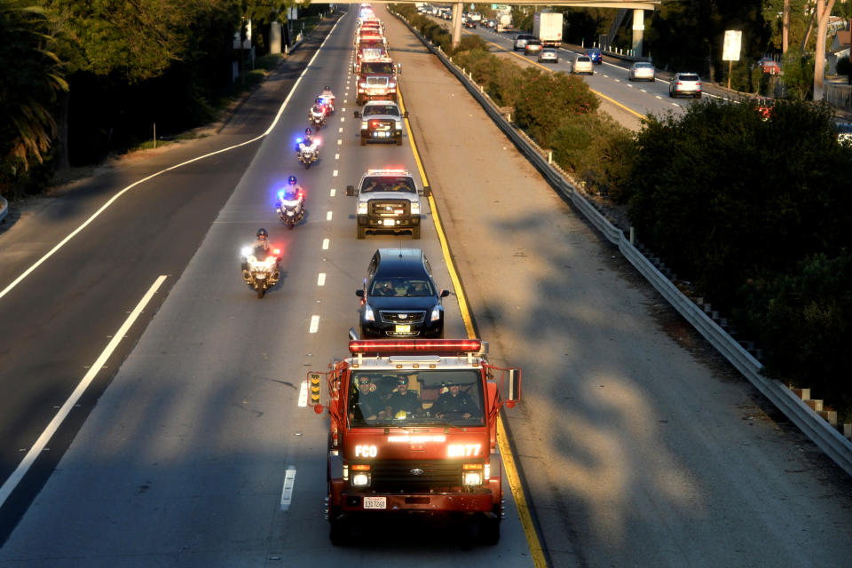 <p>A procession of firefighting vehicles passes through Santa Paula, while carrying the body of a fellow firefighter who was killed today battling the Thomas wildfire near Fillmore, Calif., Dec. 14, 2017. (Photo: Gene Blevins/Reuters) </p>