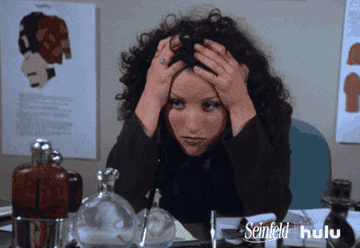 Elaine with her head in her hands on Seinfeld