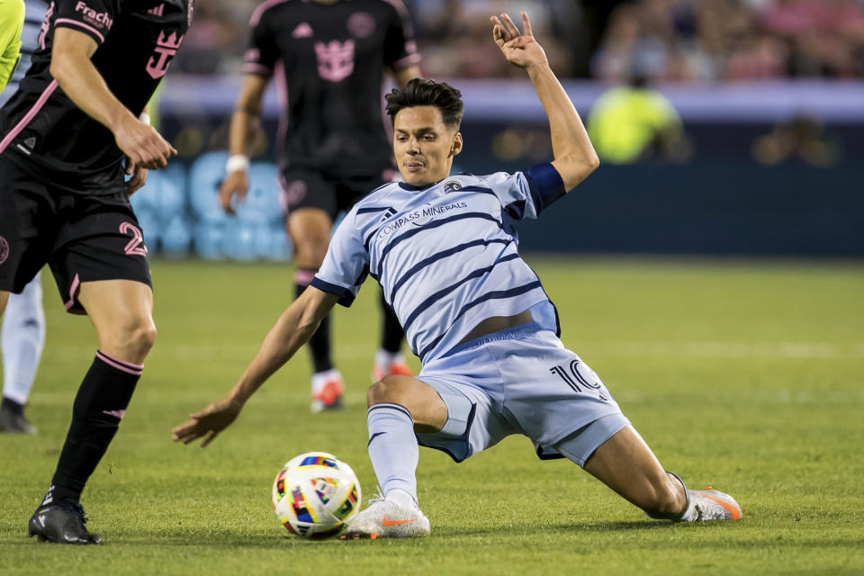 Sporting Kansas City forward Dániel Sallói (10) attempts to gain control of the ball during the first half of an MLS soccer match against Inter Miami, Saturday, April 13, 2024, in Kansas City, Mo. (AP Photo/Nick Tre. Smith)