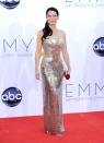 Lucy Liu, star of the freshman CBS drama "Elementary," turned heads in a glittering metal dress by Versace. "I have pliers in my purse in case anything happens," the actress cracked while dishing on her dress with Ryan Seacrest.