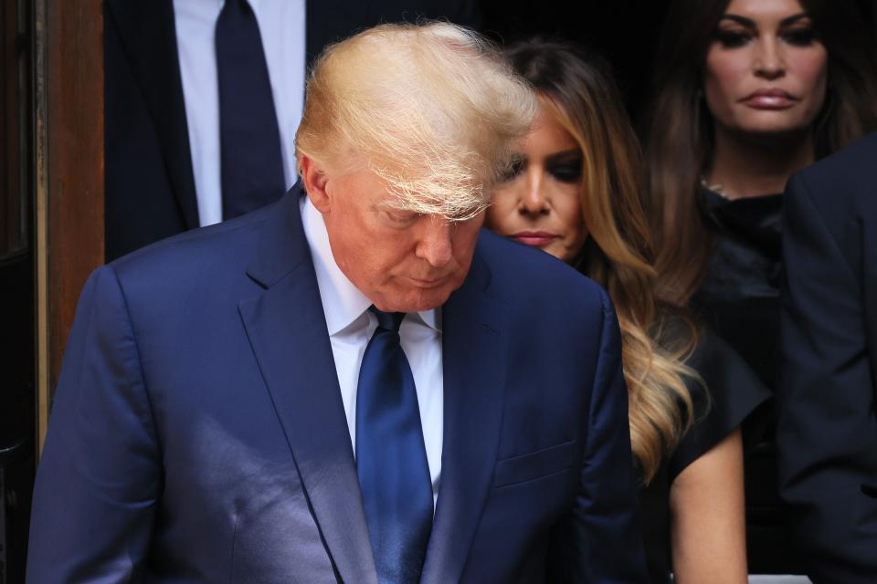 Donald Trump and wife Melania Trump follow the casket of Ivana Trump out of St. Vincent Ferrer Roman Catholic Church during her funeral (Getty Images)