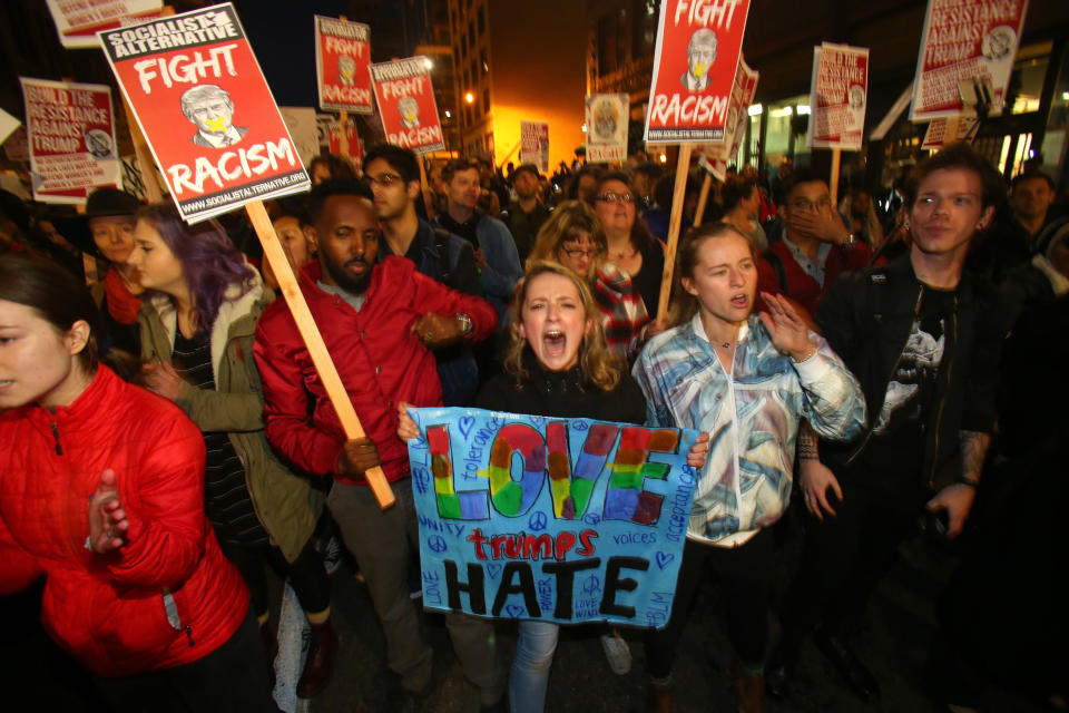 Emma Esselstyn (C), a student at the University of Washington, joins thousands of protesters marching down 2nd Avenue on November 9, 2016 in Seattle. Demonstrations in multiple cities around the country were held the day&nbsp;after Donald Trump's upset win in the&nbsp;U.S. presidential election. (Photo by Karen Ducey/Getty Images)