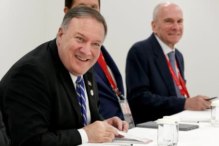 FILE PHOTO: Secretary of State Mike Pompeo, left, sits down for a meeting with Japanese Foreign Minister Taro Kono, in Osaka, Japan