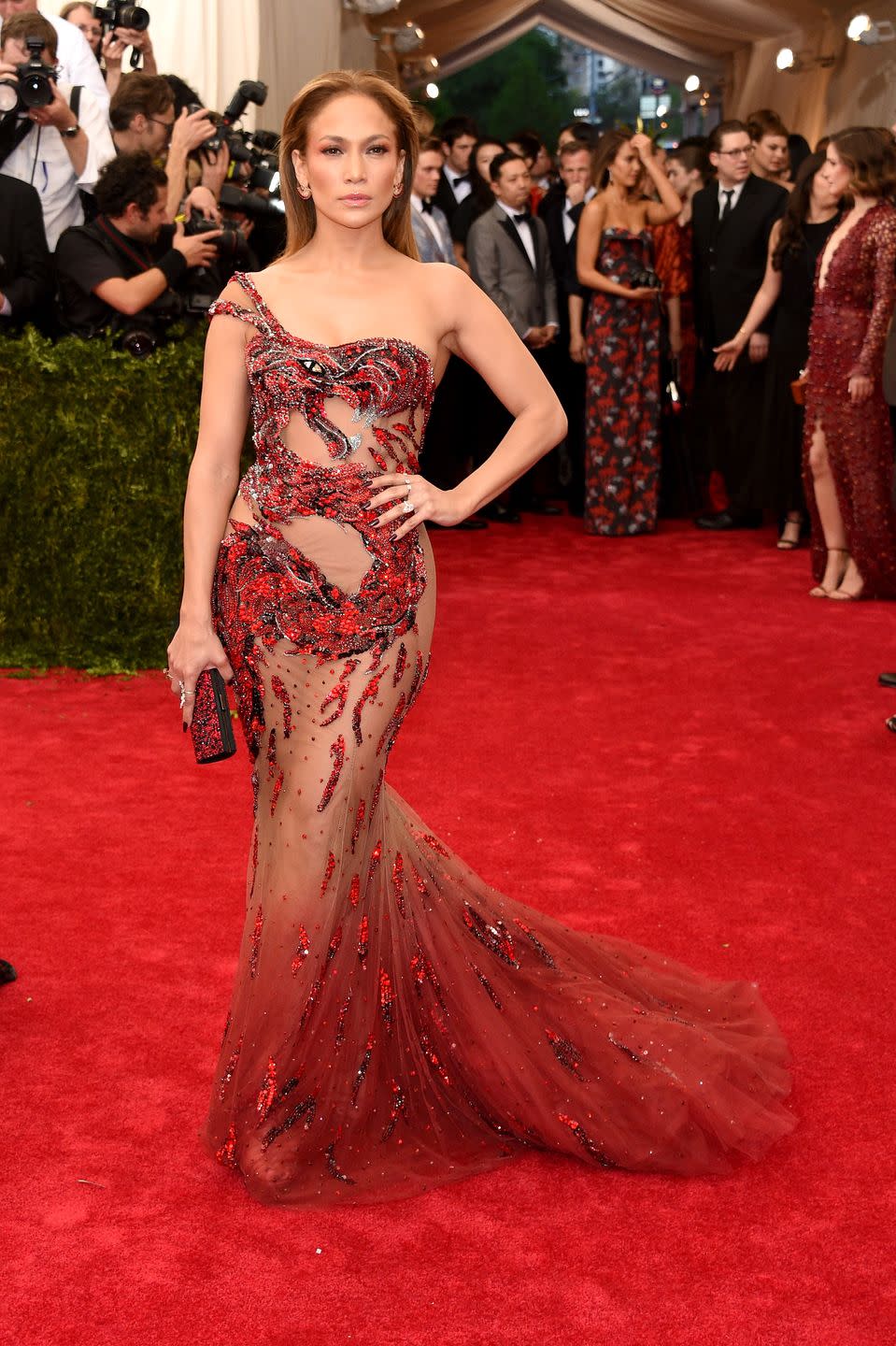 <p>While attending the 2015 Met Gala, J.Lo left a little to the imagination in a sheer nude and red gown. </p>