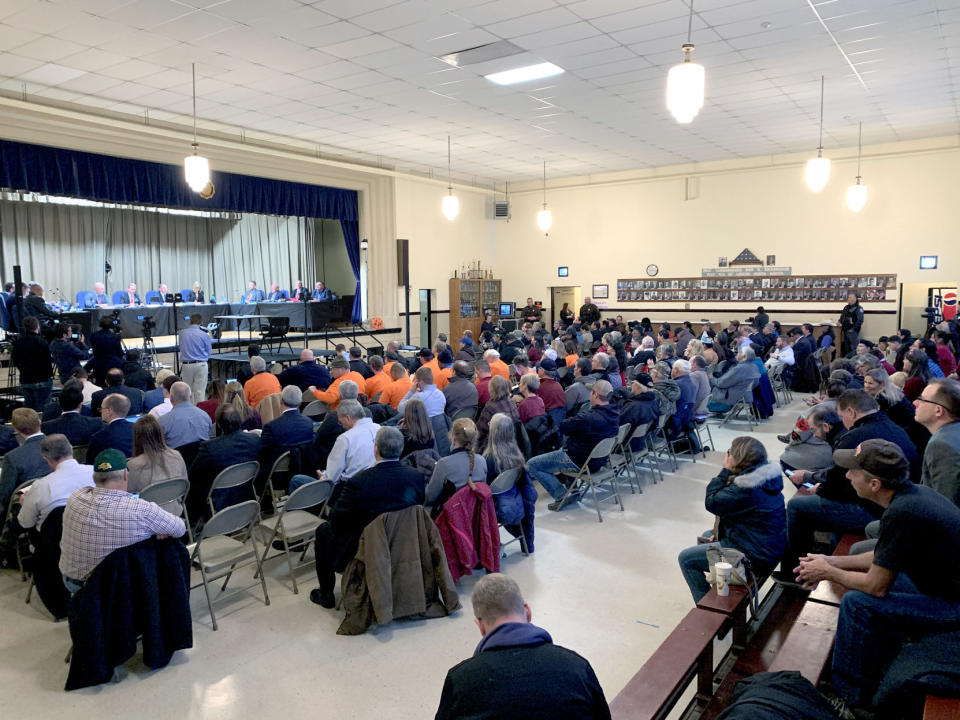 A hearing held by North Dakota regulators on a proposed expansion of the Dakota Access pipeline drew a large crowd to the Emmons County Courthouse in Linton, North Dakota on Wednesday, Nov. 13, 2019. (Amy Sisk/The Bismarck Tribune via AP)