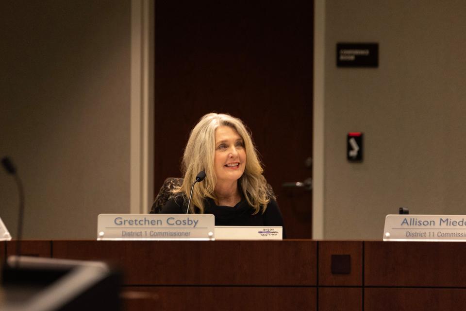 Ottawa County Commissioner Gretchen Cosby listens during a meeting in 2024.