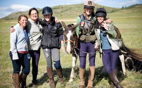 Members of the Mongol Derby Pony Club, who crossed the finish line together
