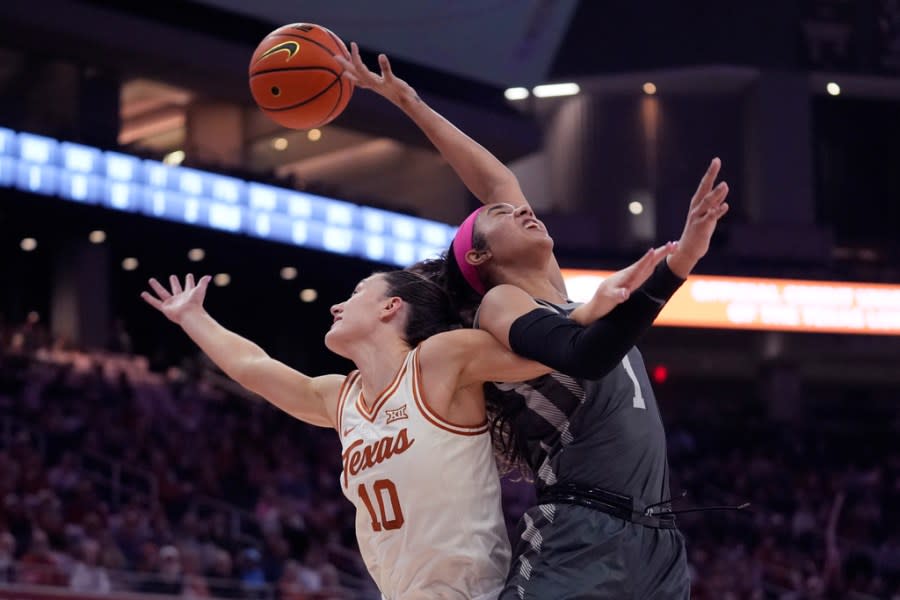 Texas guard Shay Holle (10) and Iowa State forward Jalynn Bristow (1) battle for a rebound during the first half of an NCAA college basketball game in Austin, Texas, Saturday, Feb. 17, 2024. (AP Photo/Eric Gay)