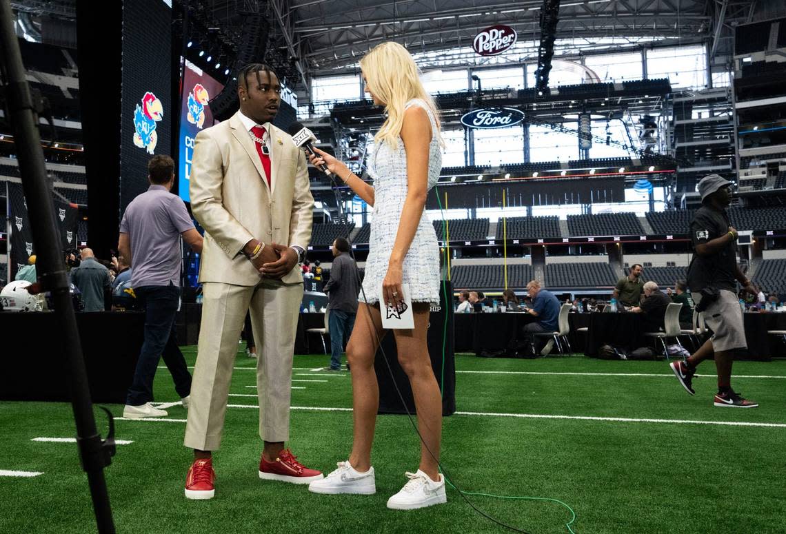 Kansas Jayhawks safety Kenny Logan Jr. speaks with Hannah Wing from ESPN during Wednesday’s proceedings at AT&T Stadium in Arlington, Texas.