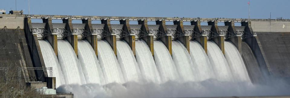 The US Army Corps of Engineers test spillway of the Hartwell Dam March 13, 2024. The rare occurrence testing the hydropower dam on the Savannah River with a water release draws spectators, many who brought children on the school day for an educational look at the area lake activity. The spill, one gate at a time, lasted two hours.