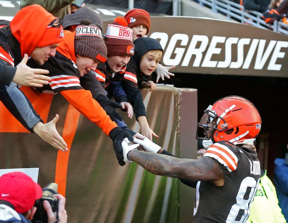 Browns wide receiver Jarvis Landry celebrates with young fans after scoring a touchdown during the first half against the Ravens on Sunday, Dec. 12, 2021, in Cleveland.