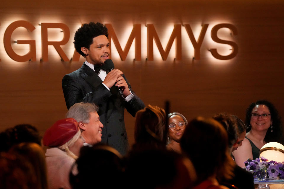 Trevor Noah speaks onstage during the 2022 Grammys